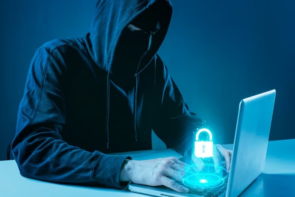 hacker typing on laptop