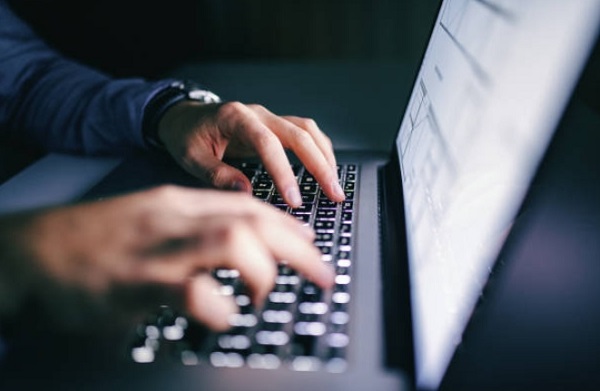 man online working for home in laptop