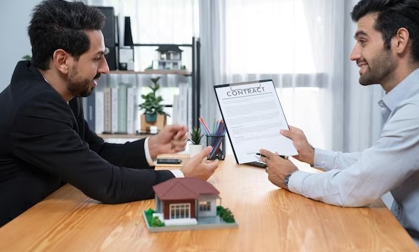 person hold contract paper in hand