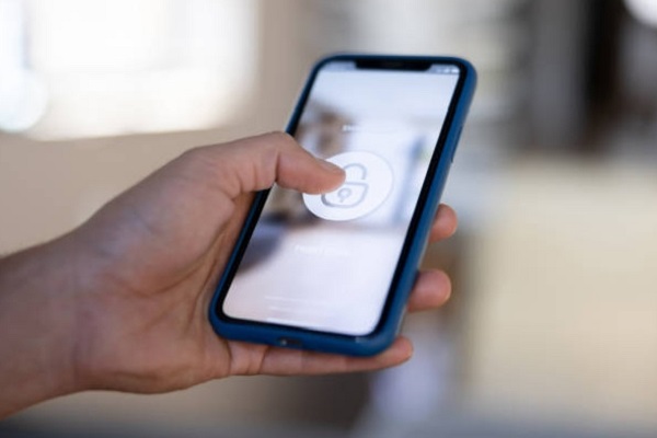 person hand holding a Unlocked iPhone