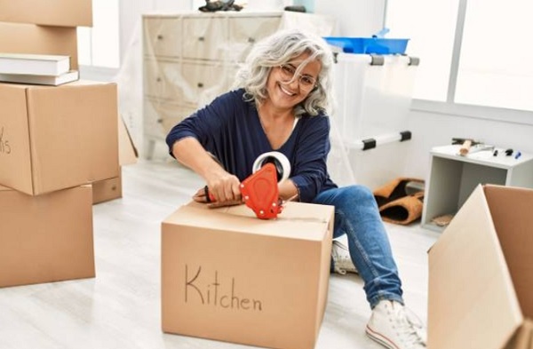 old woman packing the box