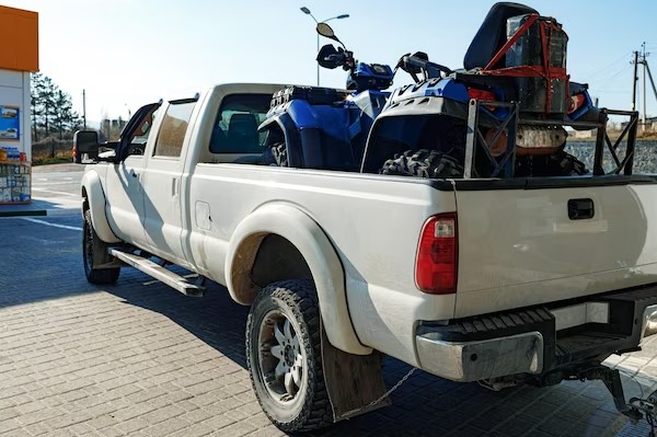 small car placed at the back of the pickup truck