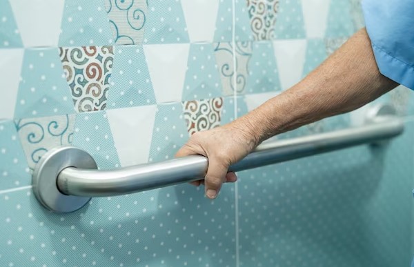 elder person hold grab bar