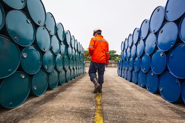 workers check the crude oil tank