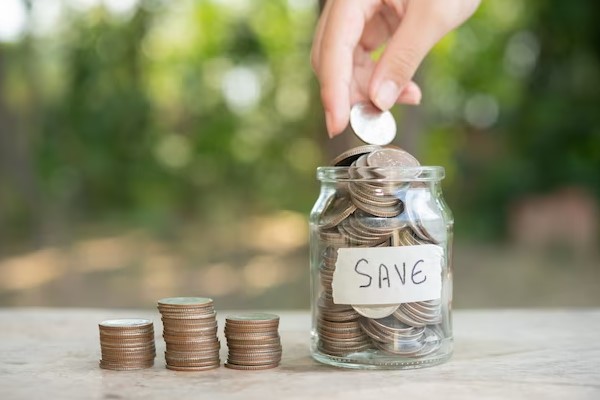 person add coins in the jar