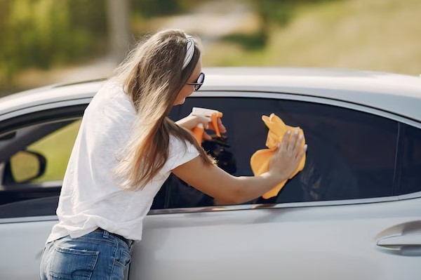Girl clean car widows