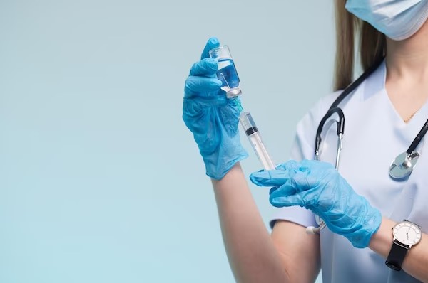 nurse holding injection