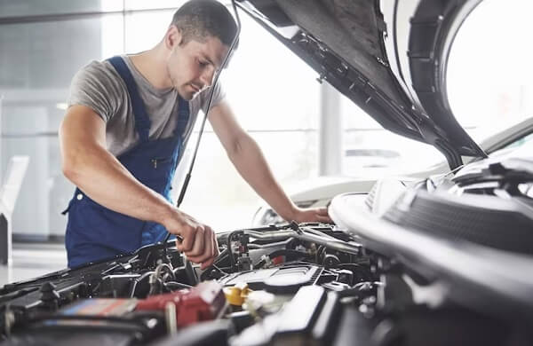 man repair car