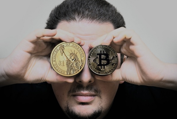 a person handholding bitcoin and one Dollar