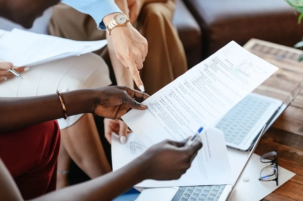 person hand holding a paper