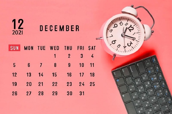 calendar-with-clock-and-other-things-on-the-pink-surface