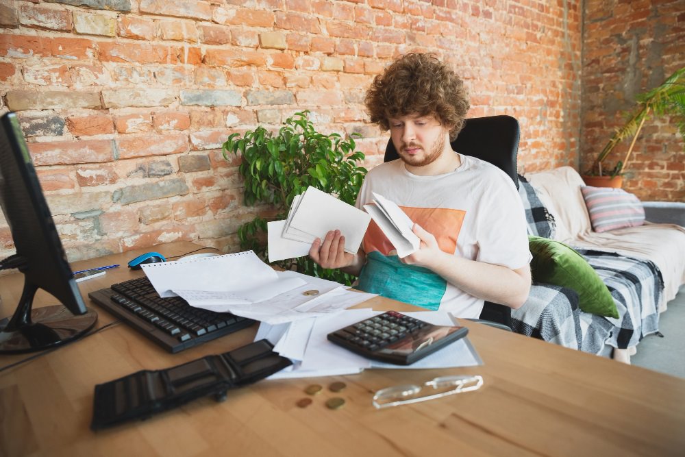 Upset and Despair Man Doing Financial Reports