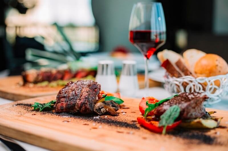 steaks and fine wines on the table