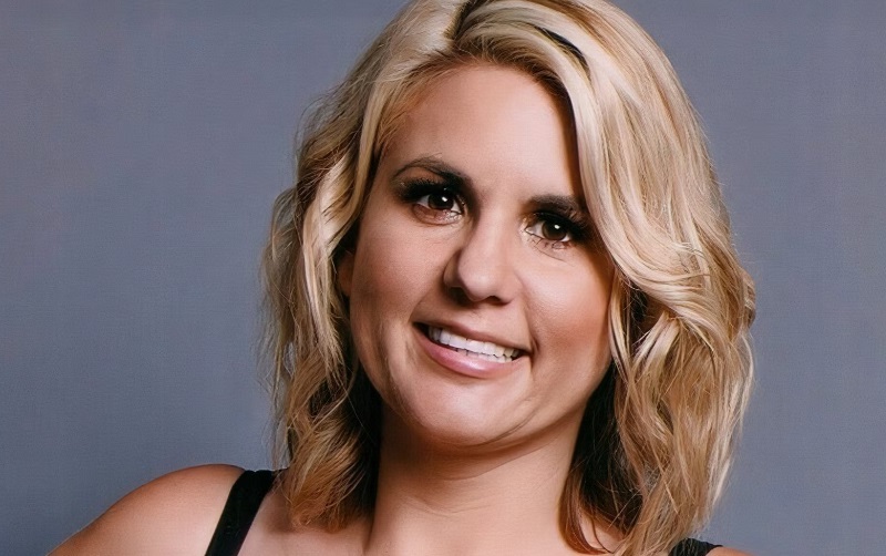 Brandi Passante smiling on Storage Wars set holding auction clipboard