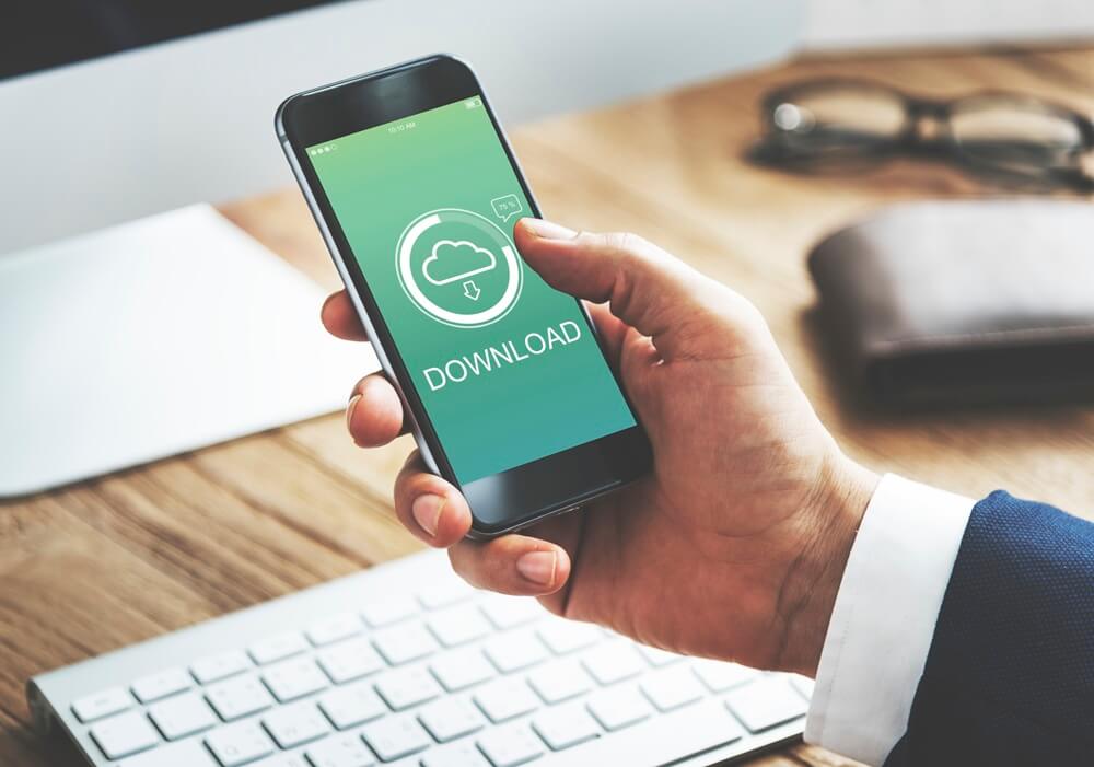 man downloading something on phone